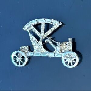 Vintage PELL antique car pin with clear rhinestones set in silvertone. Signed.